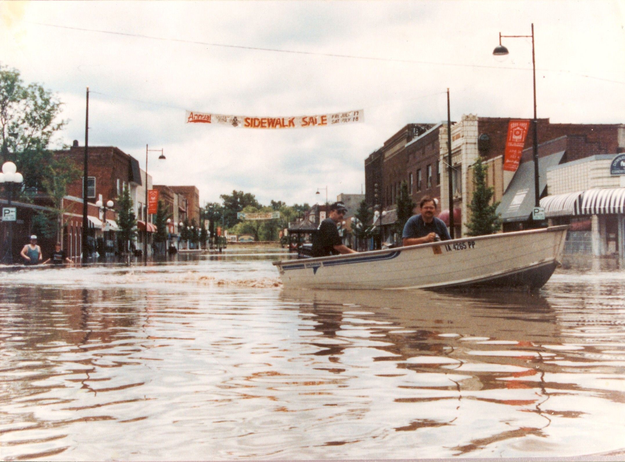 Historic photo flood of 93 two guys in boat