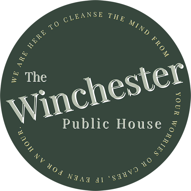 the Winchester logo green round with tilted white letters